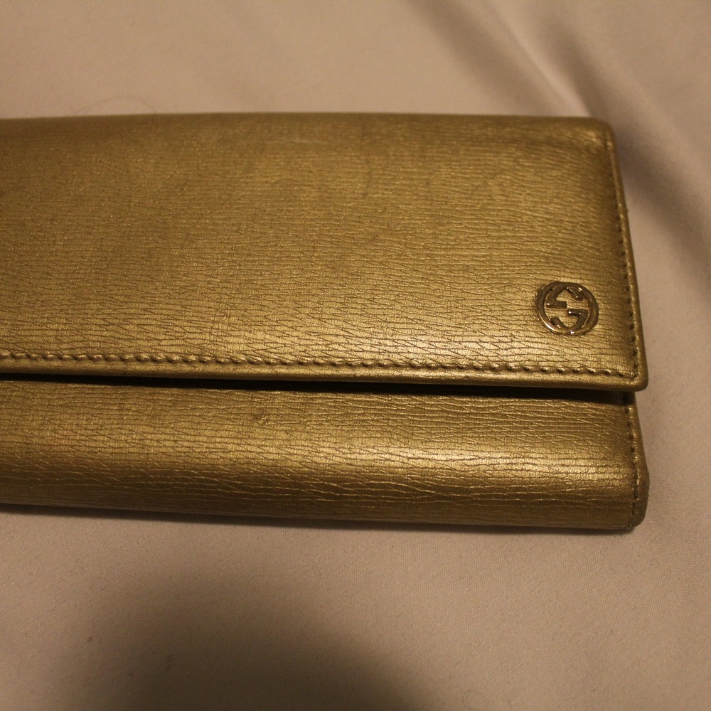 Gold gucci wallet